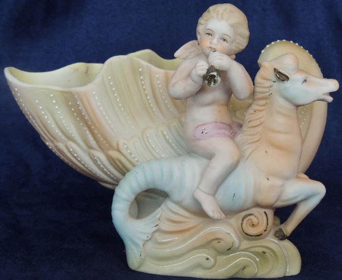 Occupied Japan figural bowl/planter, of a cherub atop a seahorse with a shell.