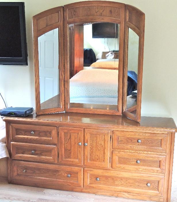 Dresser with triple mirror from the king-sized oak bedroom set.