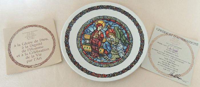 One of a series of richly colored Limoges plates, featuring religious themes from European stained glass windows.