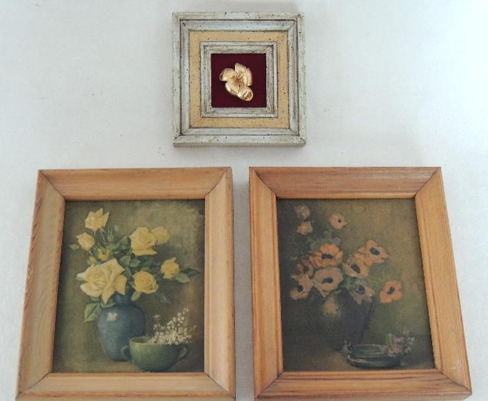 Framed floral prints; real gold electroplated plumeria blossom, souvenir from Hawaii.