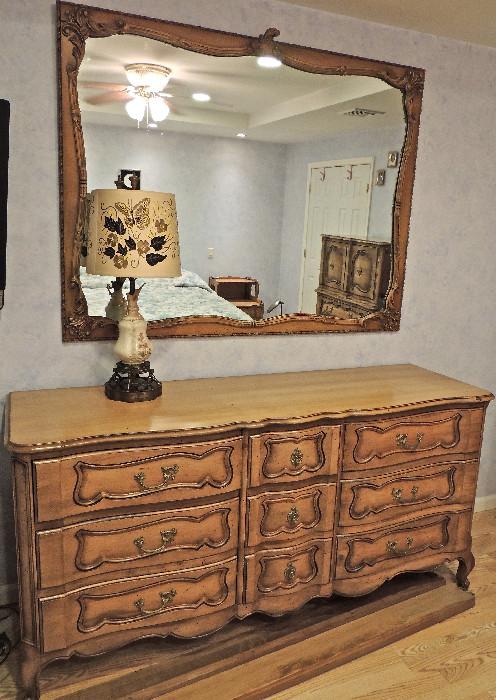 Triple dresser and mirror from fruitwood bedroom set.