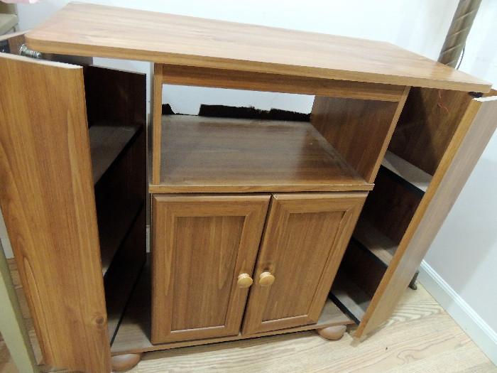 Media storage cabinet or microwave stand.