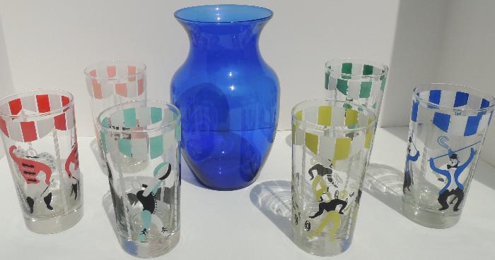 Set of vintage circus-themed tumblers; cobalt glass vase.