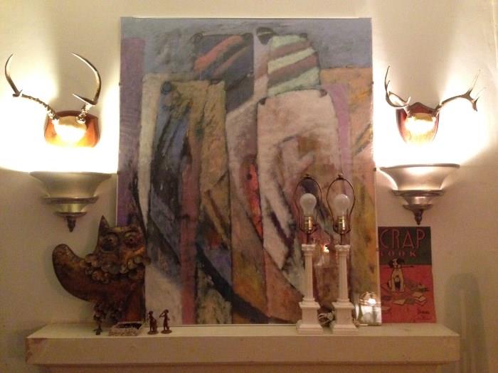 large painting, marble lamps, deco sconces, antlers, metal brutalist owl
