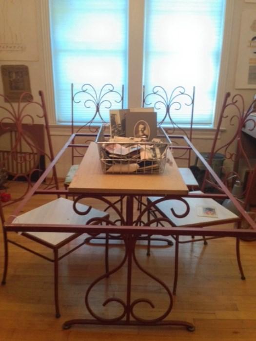 wrought iron dining table , vintage b&w photos, tintypes, tons of postcards early to 70's motels, etchings figural , architectural , etc. 