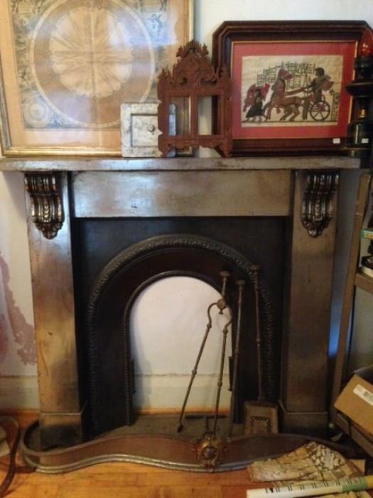 amazing steel fireplace, fireplace set, industrial cart on casters, astrological map, Egyptian art, carved Indonesian frame