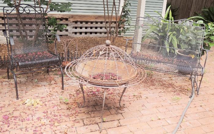 Iron outdoor furniture and gliders and fire pit