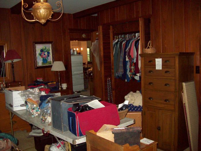 Lots of clothes, medium size, Cedar lined chest of drawers, camera equipment, mostly vintage.