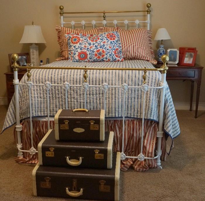 Wrought iron and brass bed and Hartmann luggage