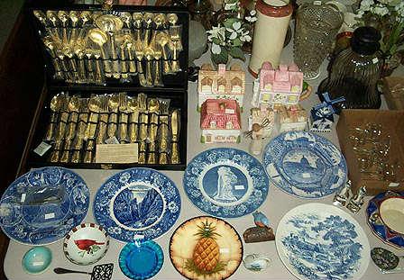 Gold plated silverware set, blue & white plates, etc..
