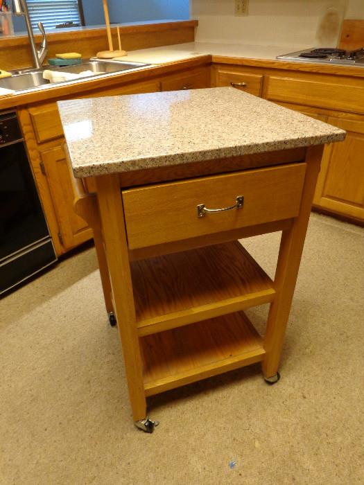 Rolling marble-top kitchen island