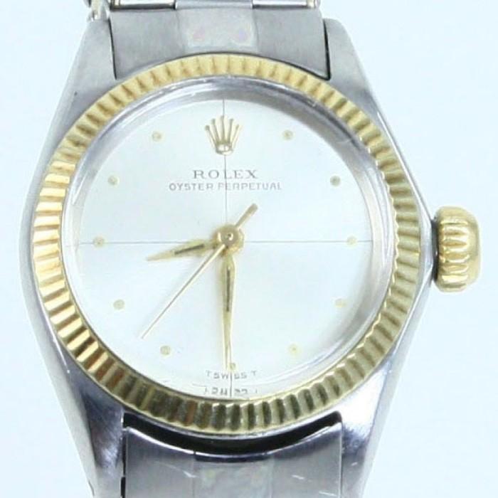 Authentic estate Rolex Oyster Perpetual Date 2-tone stainless steel lady's wristwatch: 15/16” diameter case, Swiss automatic movement, 6” bracelet, model #6619, serial #1660XXX. Watch is not running. Appraised in 2014 by A.I.G. (American International Gemologists) for $6,700. Bracelet is worn.