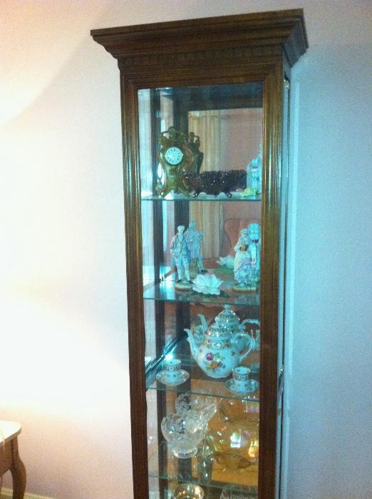 Lighted curio with side glass door.