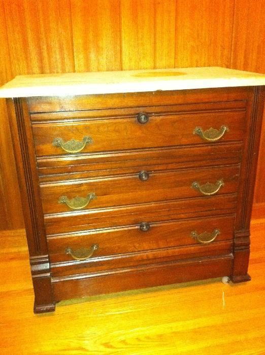 Antique walnut 3 drawer chest with marble top.