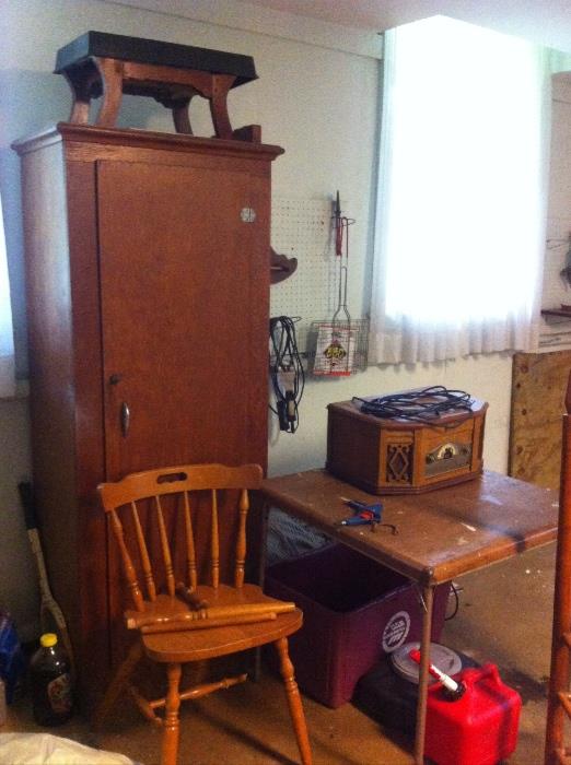 Vintage wooden cabinet, fixer upper chairs, and lots of garage items.