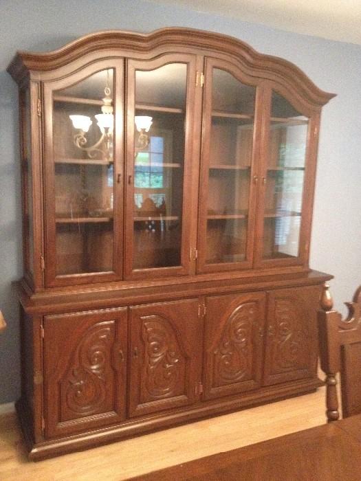   Custom-made Narra wood China Cabinet with two sets of glass panel doors above a set of lower panel cupboard doors. 