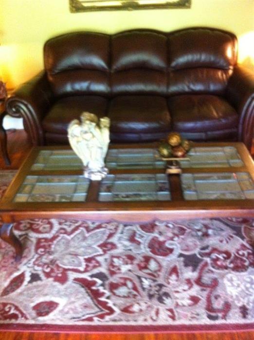 Leather sofa, leaded glass coffee table, rug