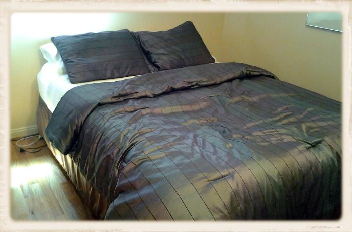 Queen bed (mattress with box spring)  Bedding also for sale.