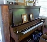 Upright "teaching" piano in sunroom/studio. Good buy! Wish it could talk...many, many folks learned to love music right here!