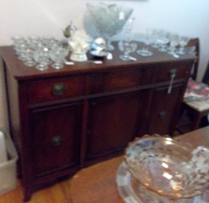 Duncan Phyfe sideboard with silver drawer and plenty of storage - good size for today's dining rooms!   Lots of elegant crystal stemware.