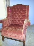 Vintage 1970's double tufted, rolled arm, Chippendale style wing chair.