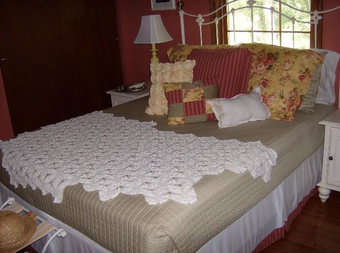Queen white wrought iron bed; complete.  Also includes comforter, bedskirt, valance, 3 euro shams, 2 standard shams and 3 throw pillows