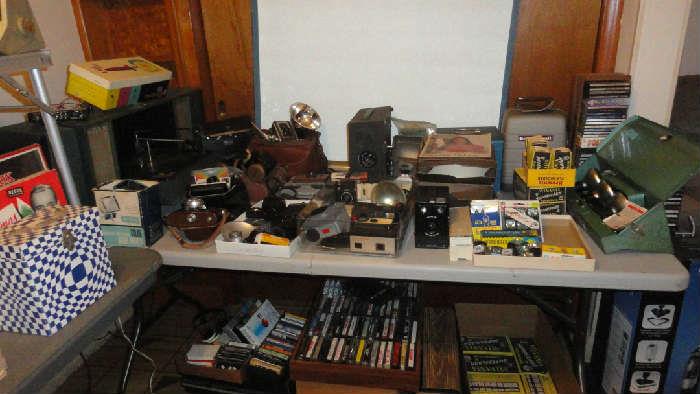 Camea equipt, slides most from 50's & 60's, tabletop stereo (needs needle), 45's and lps, cassette tapes, cd's, 8 tracks