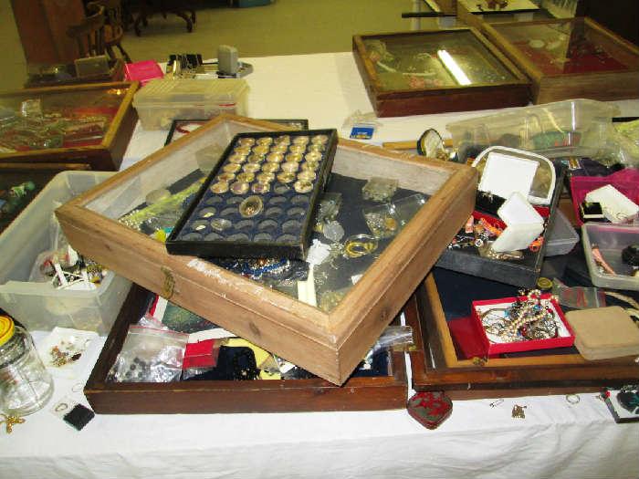 display cases full of jewelry findings, beads, pieces & parts. Consignor set up at antique shows 