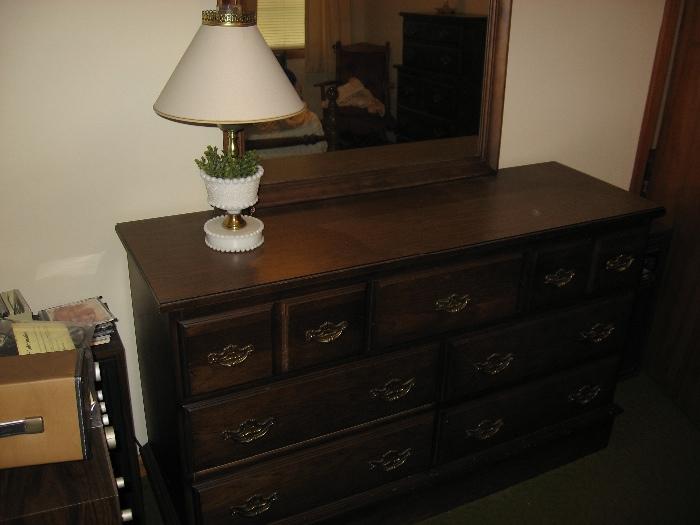 Dresser and mirror as part of bedroom suite
