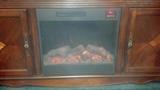 Entertainment center w/electric fireplace and remote control. 