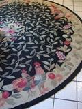 8' round area rug with rooster design.