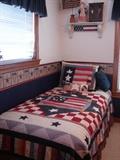 Red, white, and blue twin bed room