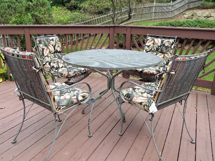 5 pc. patio set-2 swivel & 2 regular chairs, table, tropical foliage print cushions.