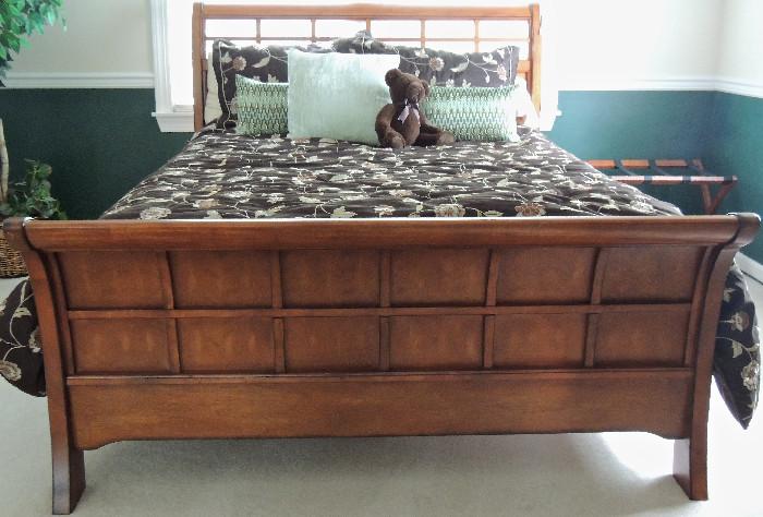 Sleigh bed with fretwork headboard by Bombay Company.