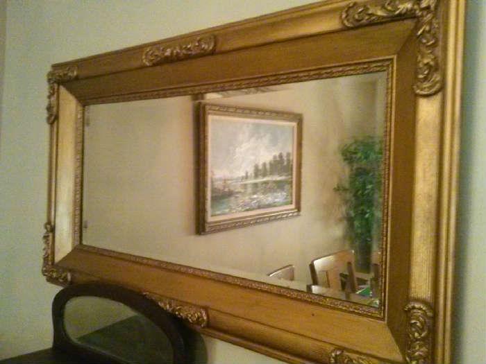 28"x48" mirror with gold frame.
