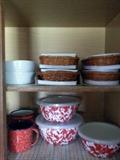Nice metal lidded bowls & mugs on the bottom shelf and basket lined baking dishes on the top ;)