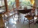 Early American formica top drop-leaf table. Five chairs (so far) not original and will be sold separately.