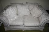 There are two High Quality white love seats