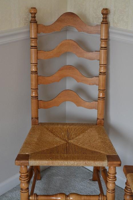 One of a pair of high back maple chairs with woven seats