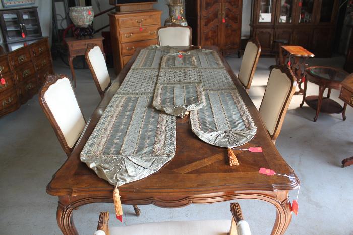 ITEM # 1012, 1013, 1014

Offered here are custom handmade dining room runner. These runners were uniquely made from some of the finest fabrics available. As a one off custom items that were designed with elegance, these masterpieces was meant to be showcased. This tapestry is truly intended to be the focalpoint of any dining room. The runners were intricately designed with class and grandeur in mind. Its tassel ends, ruffled outer corners, diamond cross edge borders and diamond cross mid-section is what makes these pieces stand out from any other runners.  The offered stylish dinning room table runner originally sold for: $400.00.