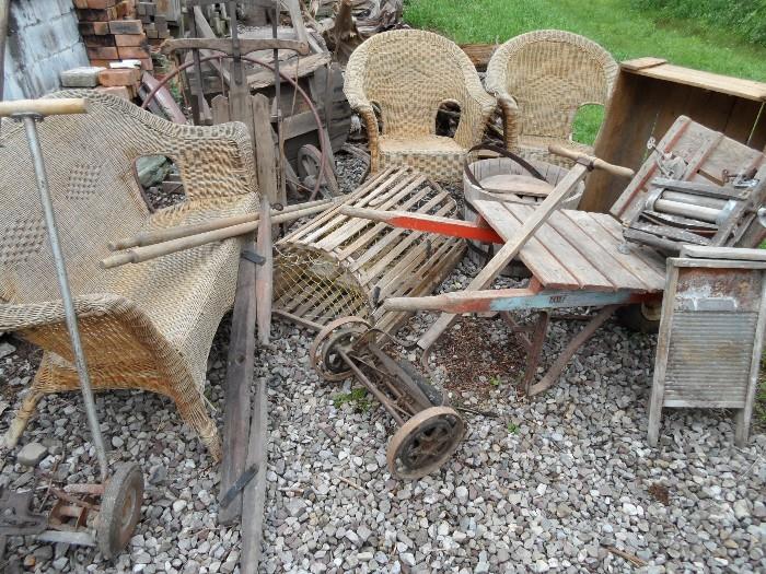 Wicker Chairs, Antique wheel barrows, wash boards, lawn mower, lobster trap, snow sled