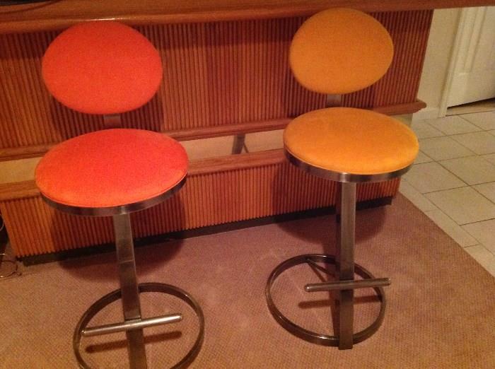 One of two sets of modern barstools.