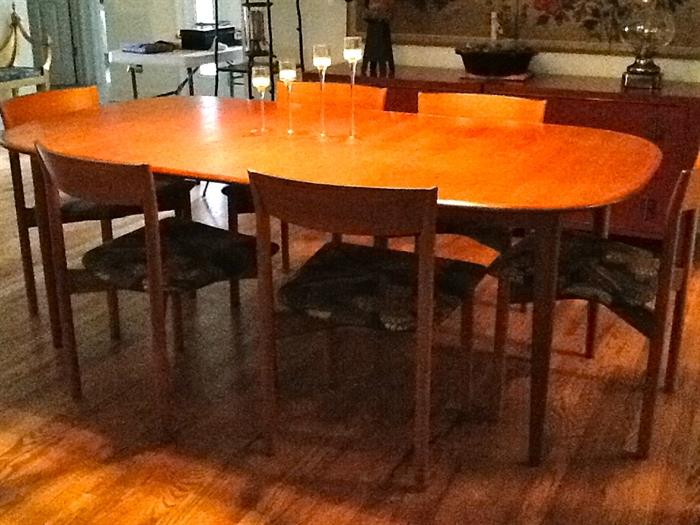 Teak 60" table with 2 self storing 20" leaves and 6 chairs