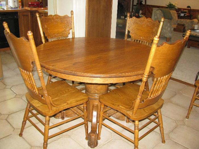 TABLE IS 48", HAS AN 18" LEAF EXPANDING TO A 66" OVAL TABLE.  INCLUDES 6 CHAIRS