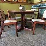 Teak dining room set. Comes with two leaves and 5 chairs.