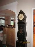 Grandfather clock which opens to store DVDs, CDs or other items.