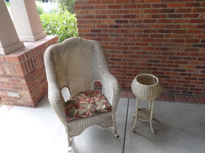 Wicker rocker and planter - Imagine yourself on the front porch reading or just enjoying the plant next to you in the stand. A quiet afternoon enjoying lemonade or reading a book.
