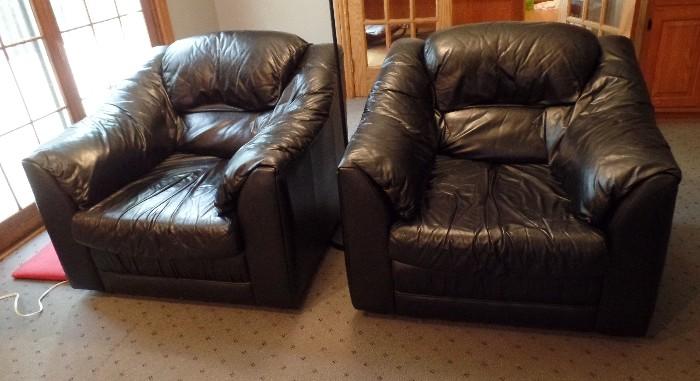 pair of leather arm chairs