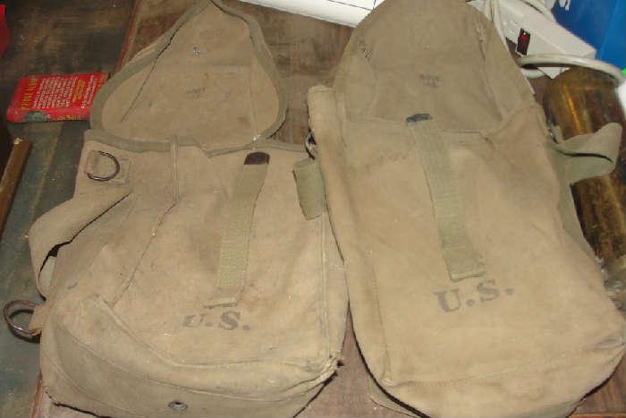 WWII canvas bags marked 'US'.