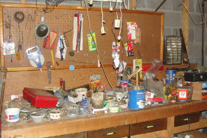 Tool room in disarray.  Lots of nuts, bolts, screws, and more